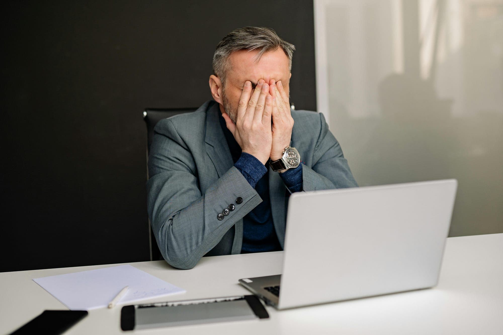 Business owner stressed in front of laptop making decisions without the right data